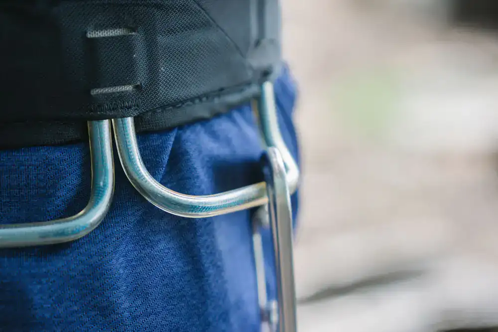Close up of a climbing harness being buckled