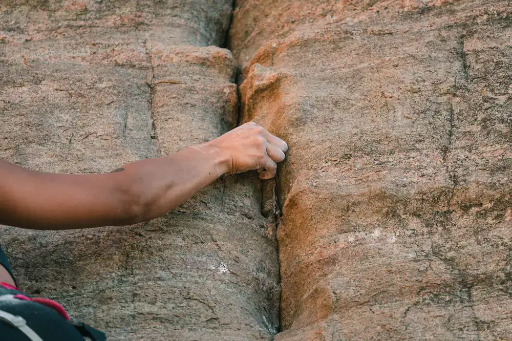 Climber navigating a complex rock face
